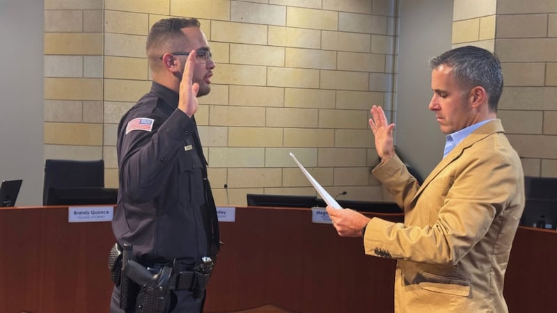 New Montgomery Police Officer Jovani Chaidez gets sworn in by Village President Matt Brolley on Sept. 8, 2025.