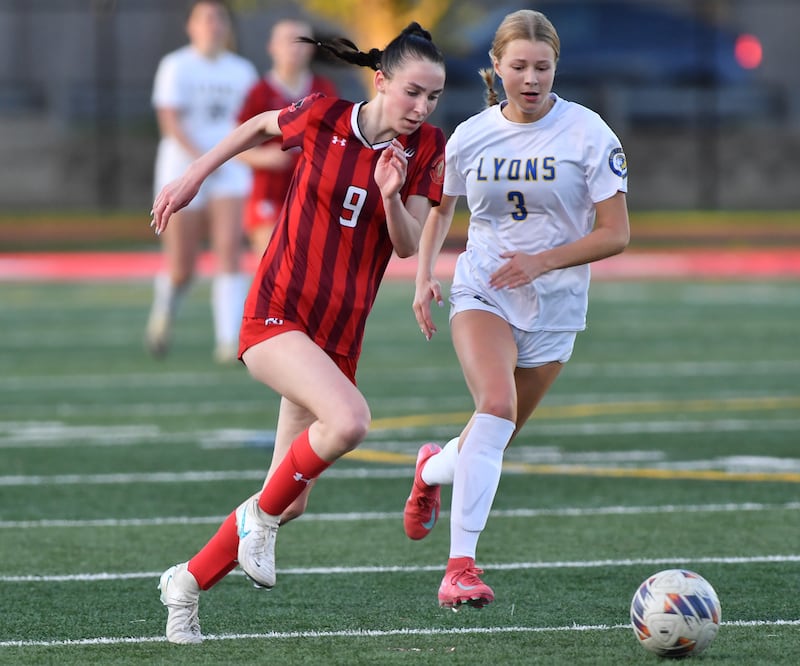 Hinsdale Central’s Caitlin Doherty (9) races for the ball with Lyons Township’s Grace Chevalier (3) during a game on April 29, 2025 at Hinsdale Central High School in Hinsdale.