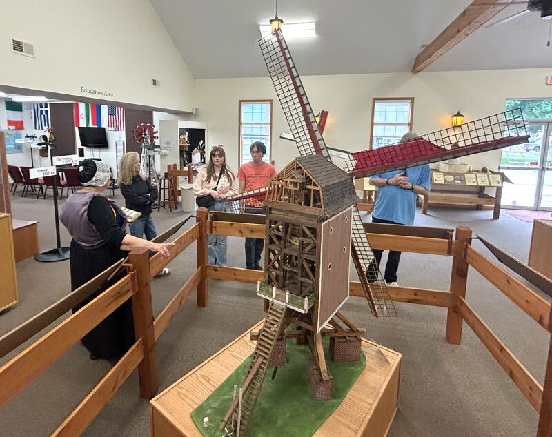 Kathy Bielema, a volunteer at the Windmill Cultural Center in Fulton, talks about the history and types of windmills as she gives a tour at the center during the 25th anniversary celebration of  Fulton's de Immigrant windmill on Saturday, June 7, 2025. Tours of the windmill and center were two of the activities offered during the day.