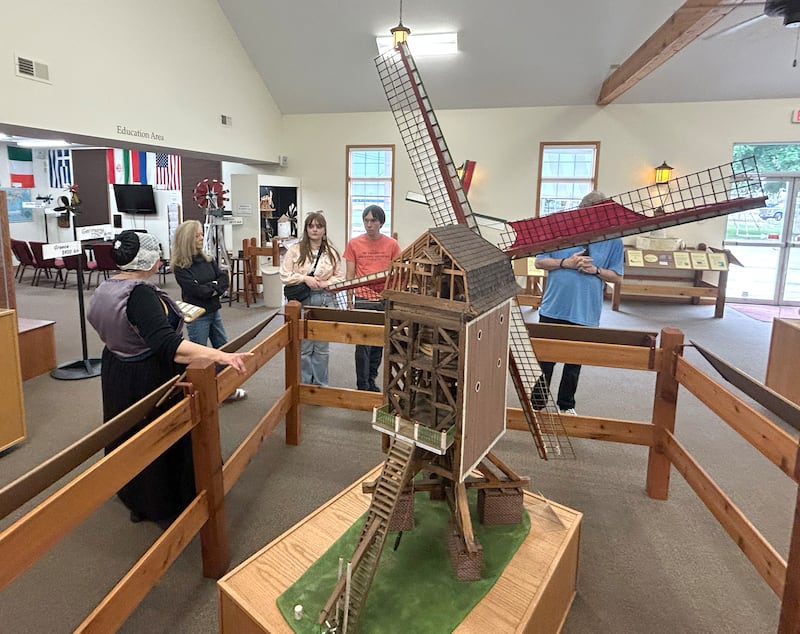 Kathy Bielema, a volunteer at the Windmill Cultural Center in Fulton, talks about the history and types of windmills as she gives a tour at the center during the 25th anniversary celebration of  Fulton's de Immigrant windmill on Saturday, June 7, 2025. Tours of the windmill and center were two of the activities offered during the day.