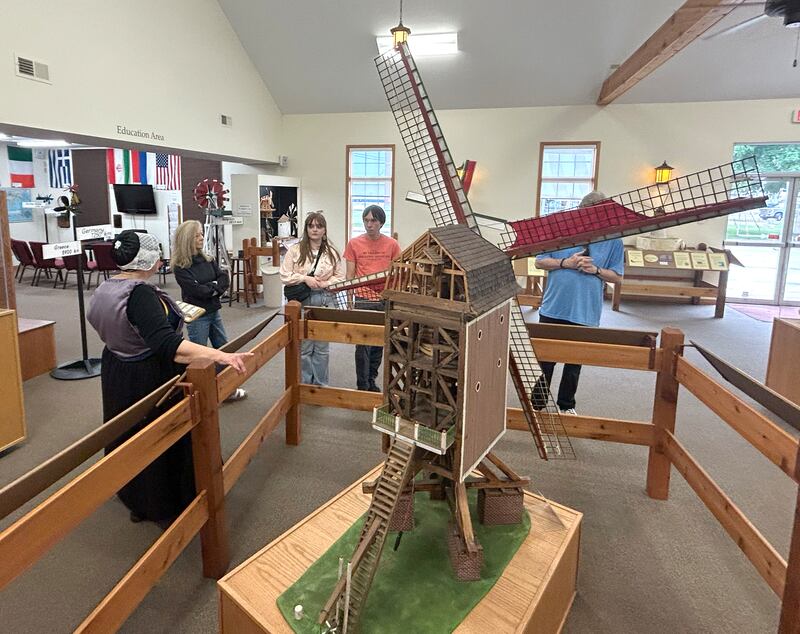 Kathy Bielema, a volunteer at the Windmill Cultural Center in Fulton, talks about the history and types of windmills as she gives a tour at the center during the 25th anniversary celebration of Fulton's de Immigrant windmill on Saturday, June 7, 2025. Tours of the windmill and center were two of the activities offered during the day.