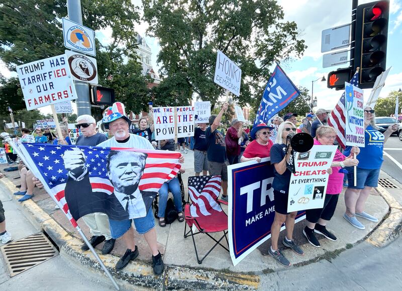 Demonstrators both for and against President Donald Trump and his policies carried signs and flags at the "Workers Over Billionaires" rally in downtown Oregon on Monday, Sept. 1, 2025. The two-hour rally was held on two of the sidewalks surrounding the historic Ogle County Courthouse.
