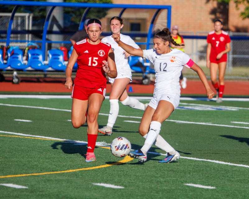 Wheaton Warrenville South's Lucy Jethani kicks the ball past Naperville Central's Kira Lambin at the Class 3A St. Charles North Supersectional Final at on Tuesday , June 2, 2026 in St. Charles.