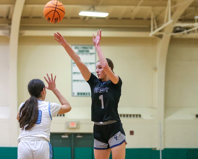 Oswego East's Aubrey Lamberti (1) shoots a jumper during their York Thanksgiving Tournament matchup between Oswego East at Downers Grove South Friday, Nov 20, 2025 in Elmhurst.
