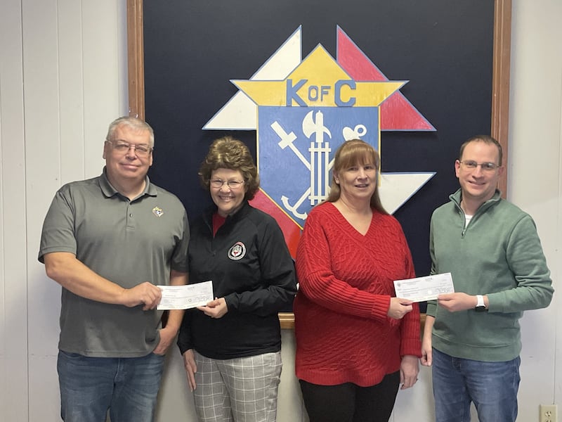 Calvert Council Knights of Columbus in La Salle raised just over $3,500 each for Horizon House and Lighted Way during the Knights' Tootsie Roll drive conducted Sept. 19-21, 2025. Presenting the checks Thursday, Jan. 29, 2026, were Kyle Foley (right), Tootsie Roll chairman to Alice Buczkowski, administrative assistant for Horizon House. At left, Grand Knight John Meyer presents a check to Jessica Kreiser, executive director Lighted Way.
