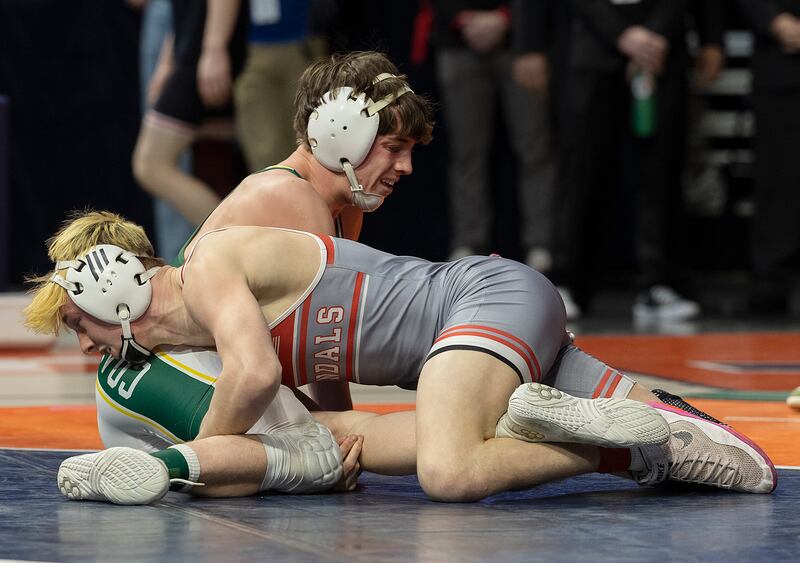 Coal City’s Cooper Morris (top) and Vandalia’s Tyson Waughtel compete in the 126 pound weight class of the 1A state individual wrestling finals Saturday, Feb. 22, 2025, at State Farm Center in Champaign.