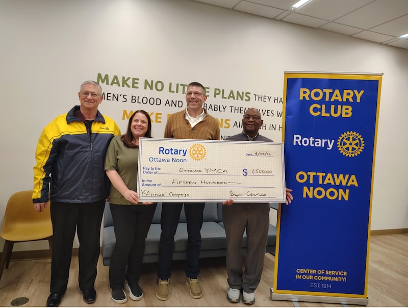 Ottawa Noon Rotary Members Dave Noble, Tracy Beattie and Brian Carnes with Executive Director and CEO of the Ottawa YMCA, Glenn Haley.