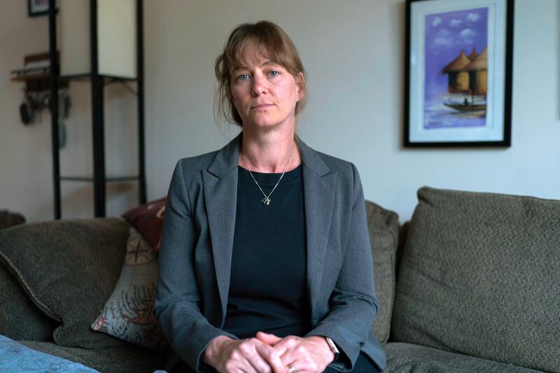Jenna Norton ,who works as a researcher at the NIH, poses for a photograph during an interview with the Associated Press in Bethesda, Md., Friday, June 6, 2025. (AP Photo/Jose Luis Magana)