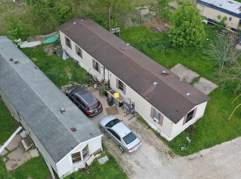 An aerial view of the home where the shooting took place in the Hummingbird Lane Mobile Home Park on Monday, May 11, 2026 in DePue. Law enforcement agencies are investigating the scene of a fatal domestic disturbance in the 2700 block of East Street west of DePue. According to the Bureau County Sheriff's Office, officers responded to a barricaded subject at a mobile home in the Hummingbird Lane Mobile Home Park. A 3-year-old later died at a local hospital, while the suspect remained hospitalized Monday afternoon.