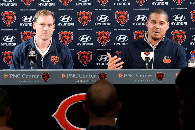 Chicago Bears general manager Ryan Poles, right, talks to media as new head coach Ben Johnson listens to him during a news conference at Halas Hall in Lake Forest, Ill., Wednesday. (AP Photo/Nam Y. Huh)