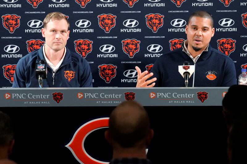 Chicago Bears general manager Ryan Poles, right, talks to media as new head coach Ben Johnson listens to him during a news conference at Halas Hall in Lake Forest, Ill., Wednesday. (AP Photo/Nam Y. Huh)
