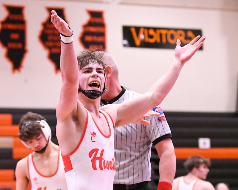 Huntley’s Colin Huminsky celebrates his first-place finish over Machesney Park’s Harlem Izayah Olejnicak during the first-place regional title match up in the 138-weight class on Saturday Jan. 31, 2026, held at DeKalb High School.