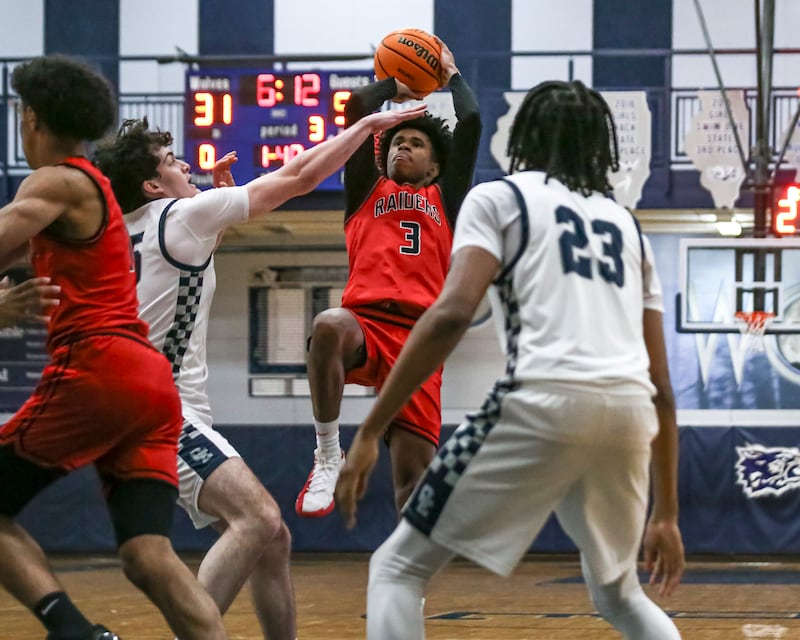 Bolingbrook's TJ Williams (3) goes up for a fade away during their basketball game between Bolingbrook at Oswego East Friday, Jan 30, 2026 in Oswego.