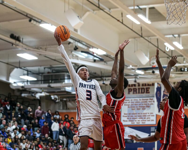 Oswego's Ethan Vahl (3) puts up a shot during their basketball game between West Aurora at Oswego Monday, Nov 24, 2025 in Oswego.