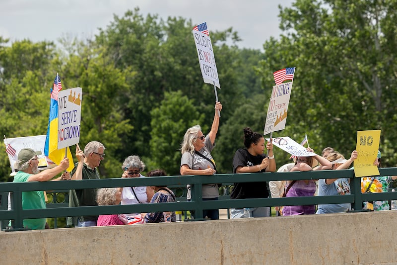 Protesters in Dixon join a nationwide No Kings protest Saturday, June 14, 2025. The anti-Trump gathering lined both sides of the Peoria Avenue Bridge.