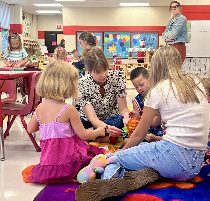 Early Childhood Education instructors Julia Atilano and Abby Campos guide preschoolers and high school student educators at Whiteside Area Career Center’s Kiddie Kampus Learning Center in Sterling on Sept. 15, 2025.