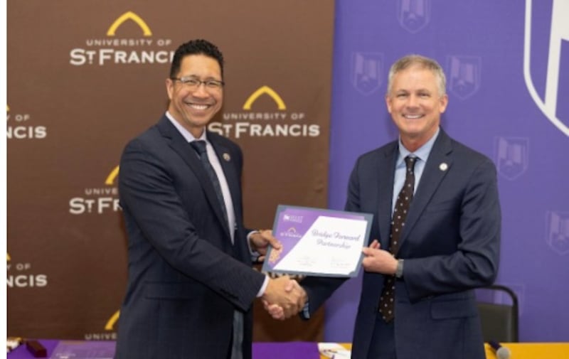 Dr. Clyne Namuo (left),  Joliet Junior College president,  and Dr. Ryan C. Hendrickson, president of the University of St. Francis. at the signing ceremony for transfer partnership agreement held on USF’s campus on March 10, 2026.