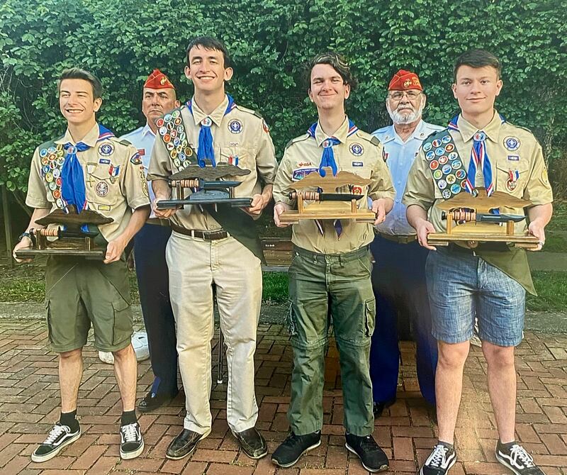Tom Bulin (second from right) with the Fox Valley Marines presents four eagle scouts in Troop 26 with the ceremonial combat knife. Also pictured, Mark Hernandez of Oswego.
