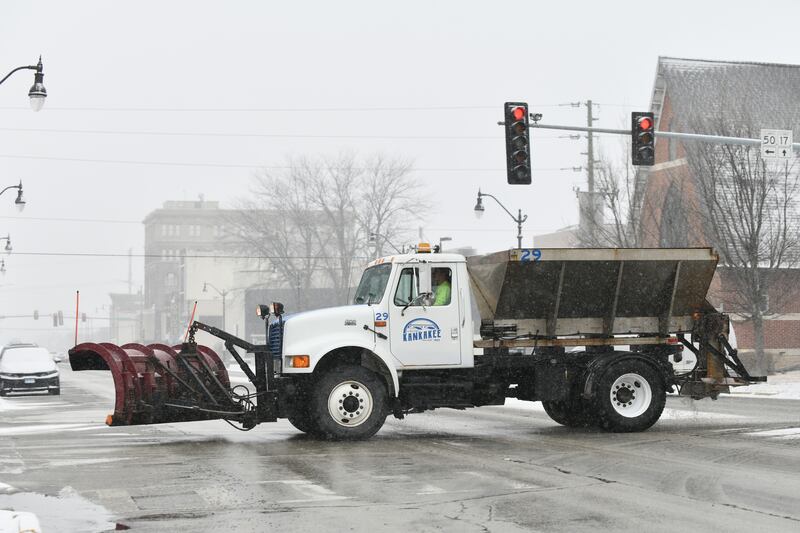 A snowplow travels along South Indiana Avenue Tuesday, Feb. 12, as snow arrived to the Kankakee area.