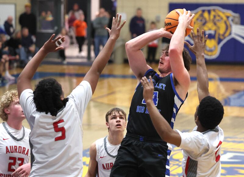 Hinckley-Big Rock's Martin Ledbetter shoots between four Aurora Christian defenders during their sectional final game Friday, March 7, 2025, at Somonauk High School.