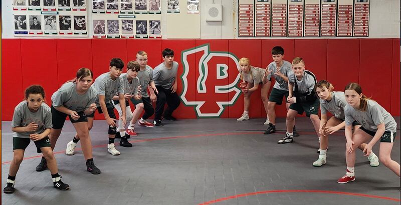 The L-P Crunching Cavs are sending a group of wrestlers to the Illinois Kids Wrestling Federation state tournament this weekend. Pictured (from left) are Sophia Smith (Intermediate division, 72 pounds), Collins Miller (Intermediate, 135), Jake Kasprak (Novice, 93), Brody Sliker (Senior, 84), Aiden Urbanc (Novice, 134), Karson Kelly (Senior, 188), Audriana Plut (Senior, 145), Thomas Hughes (Novice, 125), Brycen Miller (Novice, 125), Stephanie Hawkins (Novice, 102) and Isabella Grisham (Novice, 90). Collins Miller, Hawkins and Plut were sectional champions, while Plut, Urbanc, Kelly, Hawkins and Brycen Miller were regional champions.