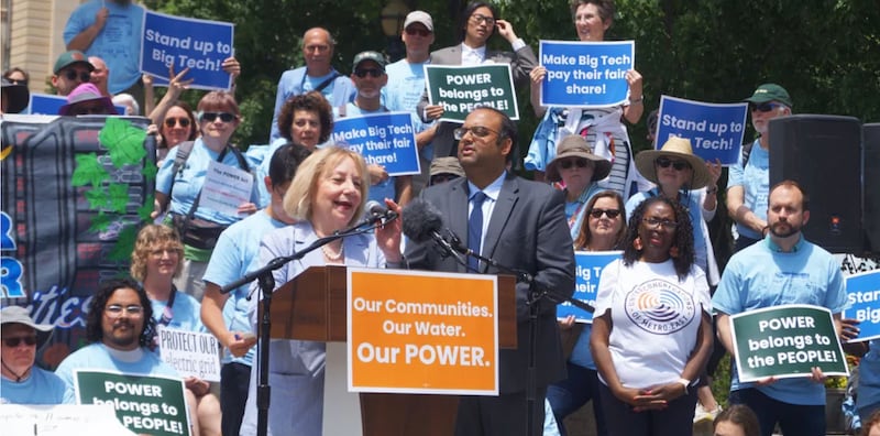 Rep. Robyn Gabel, D-Evanston, and Sen. Ram Villivalam, D-Chicago, speak at a rally for the POWER Act, a bill regulating data centers, about the bill’s next steps after the session ends.