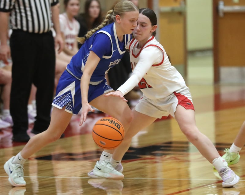 Huntley's Luca Garlin tries to steal the ball away from Burlington Central's Ashley Waslo during a Fox Valley Conference girls basketball game on Tuesday Jan. 13, 2026, at Huntley High School.