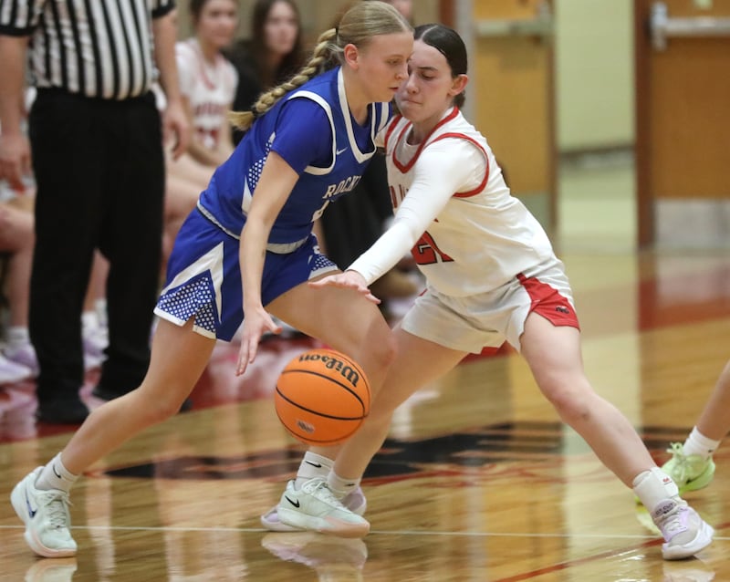 Huntley's Luca Garlin tries to steal the ball away from Burlington Central's Ashley Waslo during a Fox Valley Conference girls basketball game on Tuesday Jan. 13, 2026, at Huntley High School.