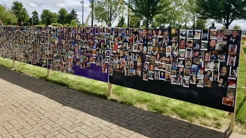 Memorial wall covered in photos of those killed by fentanyl, created during the 8th annual Ride For John, held by My Child's Life Matters at Carol Stream Town Center at 960 N Gary Ave.