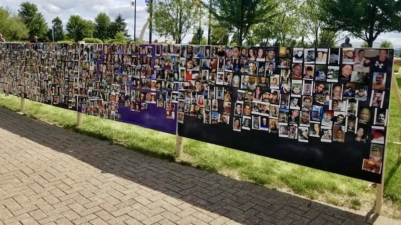 Memorial wall covered in photos of those killed by fentanyl, created during the 8th annual Ride For John, held by My Child's Life Matters at Carol Stream Town Center at 960 N Gary Ave.