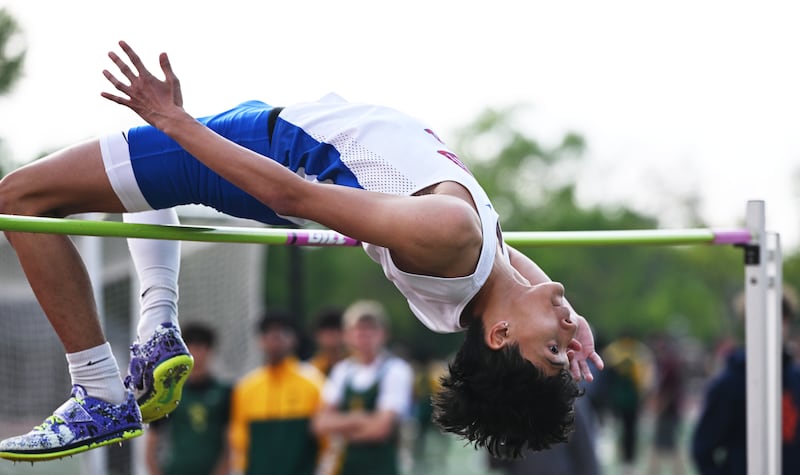 Glenbard South’s Elijah Danguilan clears the bar while competing in high jump during the DuKane County boys track and field meet hosted by York on Friday, May 8, 2026 in Elmhurst.