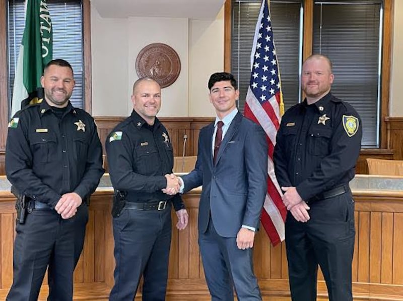 Newly sworn-in Ottawa Police Officer Alex Mata poses for a photo with Chief Mike Cheatham, Capt. Kyle Booras, and Capt. Marc Hoster on Friday, May 2, 2025, at City Hall.