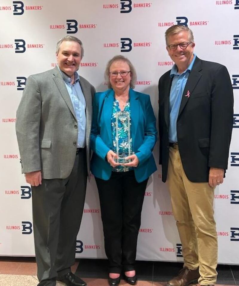 Stillman Bank President & CEO Tom Hughes (left) and Illinois Bankers Association President & CEO Randy Hultgren (right) pose for a photo with Stillman Bank Vice President & Director of Retail Banking Kathy Yocum, 2025 IBA Woman of the Year.