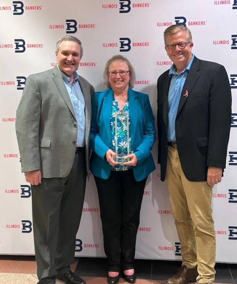 Stillman Bank President & CEO Tom Hughes (left) and Illinois Bankers Association President & CEO Randy Hultgren (right) pose for a photo with Stillman Bank Vice President & Director of Retail Banking Kathy Yocum, 2025 IBA Woman of the Year.