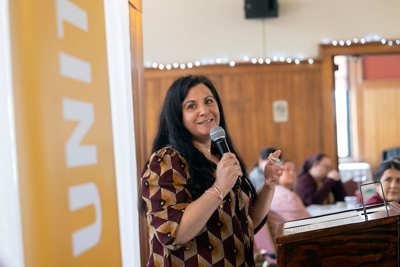 YWCA Executive Director Rebecca Munoz-Ripley accepts the Partner Agency of the Year award Thursday, May 1, 2025, from the Lee County United Way.