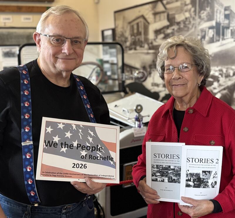 Pictured are newly-elected Board President Terry Dickow and Immediate Past President Janet Stewart holding the museum’s 2026 We the People of Rochelle calendar and copies of STORIES and STORIES 2 by Tom McDermott that are available for purchase at the museum.