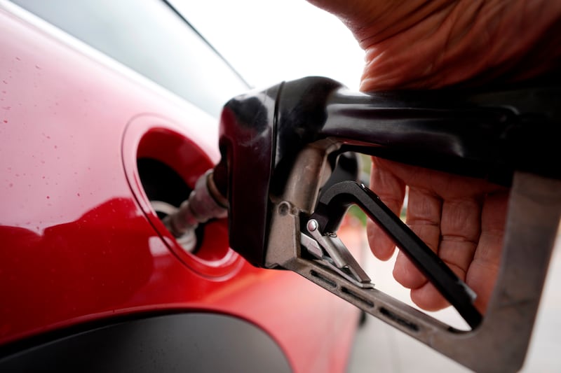 FILE - A motorist pumps fuel at a Shell station Wednesday, July 5, 2023, in Englewood, Colo. (AP Photo/David Zalubowski, File)