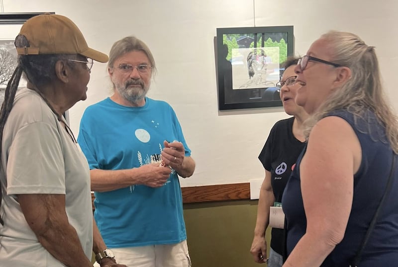 Guests at a Woodlawn Arts Academy art exhibit opening view the artwork and visit with artists. The Academy is currently calling for entries for its 2026 Juried Art Exhibit, co-presented by Sauk Valley Community College. Entries are due July 13, and the exhibit opens Aug. 21.