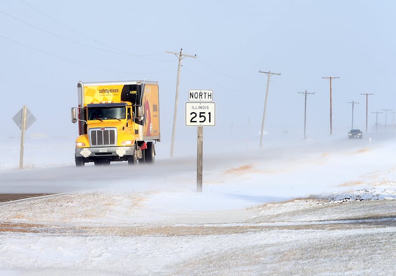 A truck travels southbound on Illinois Route 251 near 35th road on Wednesday Jan. 5, 2022 between Peru and Mendota. High winds are gusting upwards of 50-60mph are creating white-out conditions in some areas. Patchy blowing snow is occurring in open areas mainly on north and south roads. The area remains under a winter weather advisory as frigid arctic air has taken hold and will hold the remainder of the work week.