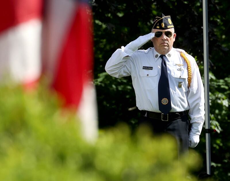 DeKalb American Legion Post 66 Honor Guard member Bob Maciejewski salutes the flag during the “Star Spangled Banner” Monday, May 26, 2025, during the Memorial Day ceremony at Ellwood House in DeKalb.
