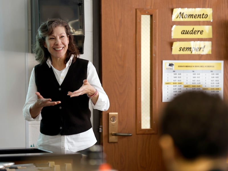 Daily Herald Top Teacher Amy Schwartz works with her eighth-grade students at Edison Middle School in Wheaton.