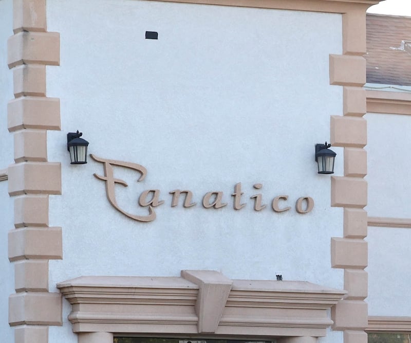 Firefighters exit the site of a structure fire Friday, Sept. 1, 2023, in the building that once housed Fanatico Italian restaurant at 1215 Blackhawk Road in DeKalb.