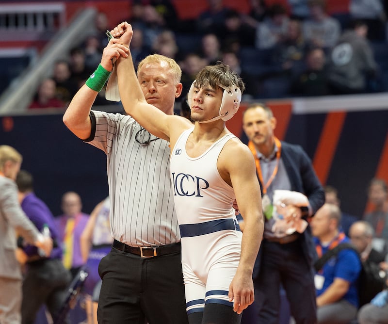 IC Catholic’s Deven Casey celebrates his win over Civic Memorial’s Bradley Ruckman in the 132 pound weight class of the 2A state individual wrestling finals Saturday, Feb. 22, 2025, at State Farm Center in Champaign.