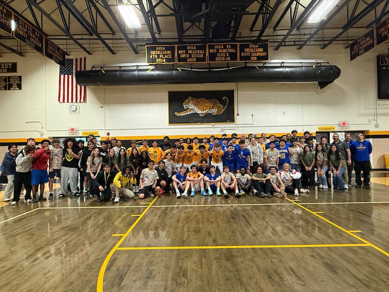 Members of the Joliet Central Steelmen and Joliet West Tigers boys volleyball teams after their Volley4Vets Showdown event on Tuesday, May 12, 2026.