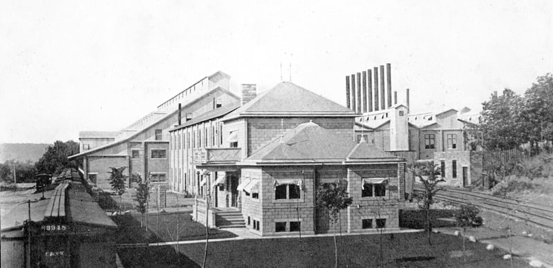 This postcard shows Dixon's cement plant in 1914. The building in front is the office, which faced the river off to the left.