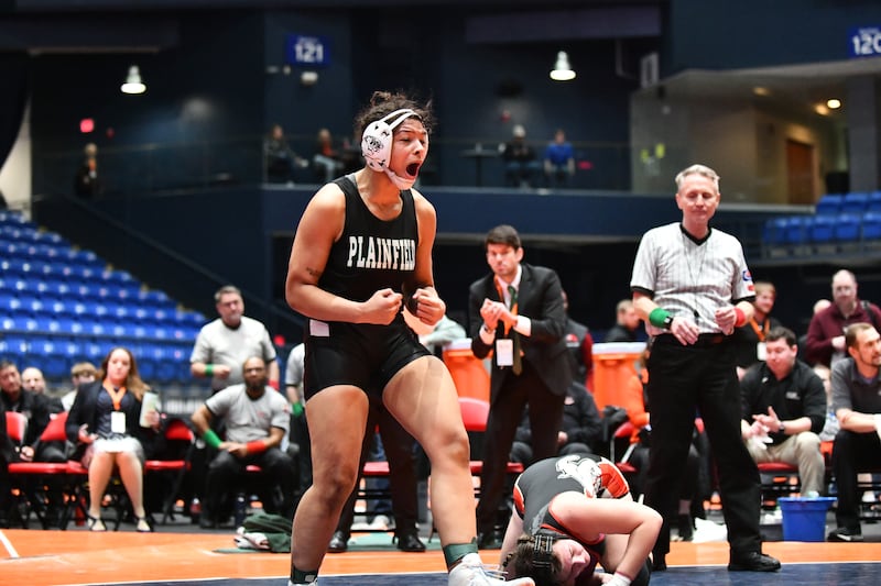 Alicia Tucker of Plainfield Central celebrates her 170-pound championship victory in the IHSA Girls Individual State Finals on Saturday, March 1. Tucker claimed first place over August Rottmann of Highland.