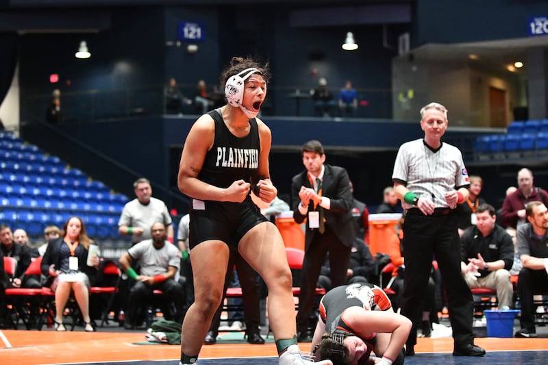 Alicia Tucker of Plainfield Central celebrates her 170-pound championship victory in the IHSA Girls Individual State Finals on Saturday, March 1. Tucker claimed first place over August Rottmann of Highland.