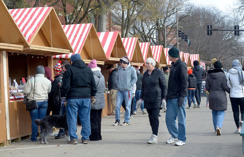 Large crowds attended the opening weekend of the Chris Kringle Market in Ottawa. The market  contains 75 wood frame huts offering a variety of food and gift ideas at the Jordan Block and on Jackson Street.