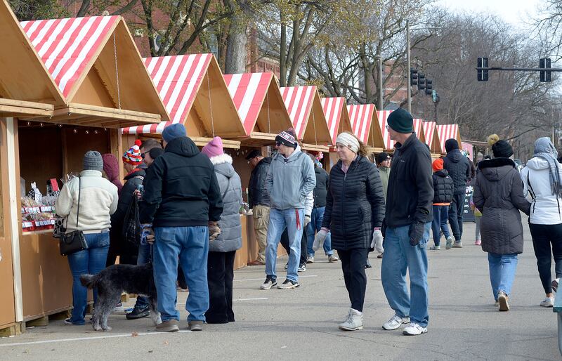 Large crowds attended the opening weekend of the Chris Kringle Market in Ottawa. The market  contains 75 wood frame huts offering a variety of food and gift ideas at the Jordan Block and on Jackson Street.