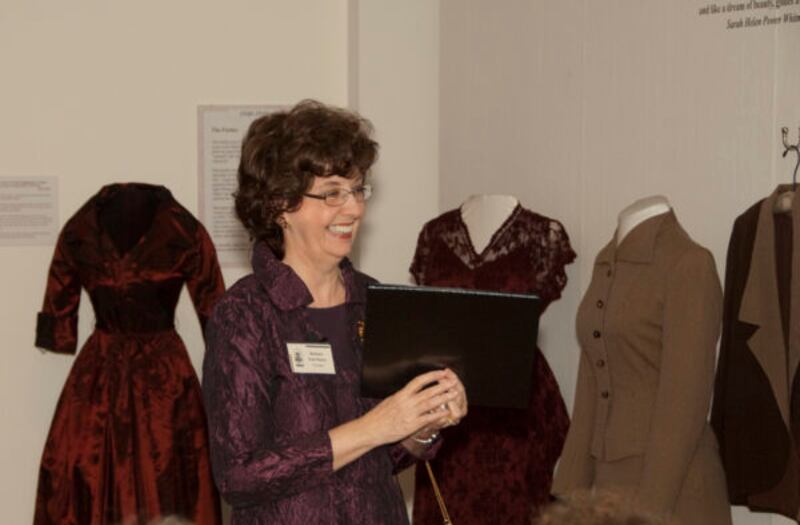The late Barbara Cole Peters, shown in this 2010 file photo, greets attendees after giving a presentation for her art exhibit "The Autumn Leaves" on Northern Illinois University campus in DeKalb. Peters, who died on Nov. 11, 2024, was remembered as NIU's First Lady when her husband, John Peters, was NIU president.